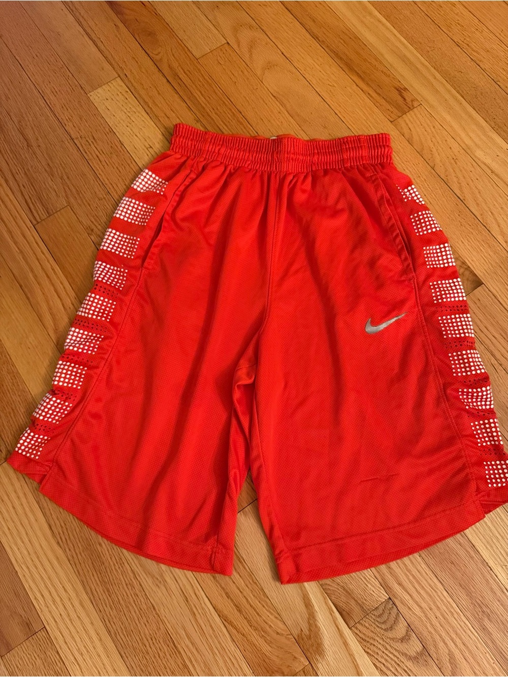 Nike Orange Basketball Shorts with White Striping and Silver Swoosh